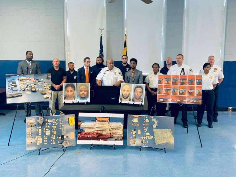 Baltimore Police Commissioner Michael Harrison, Baltimore Mayor Brandon Scott, and other officials at a news conference held July 7, 2021 to announce a series of arrests. Photo courtesy Scott's Twitter account @mayorbmscott.