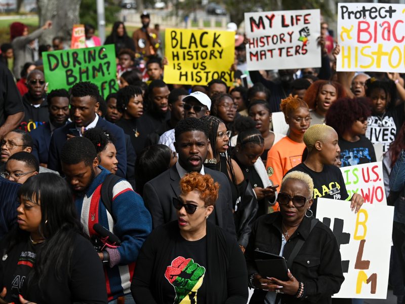 Demonstrators protest Florida Governor Ron DeSantis plan to eliminate Advanced Placement courses on African American studies in high schools as they stand outside the Florida State Capitol on February 15, 2023, in Tallahassee, Florida.