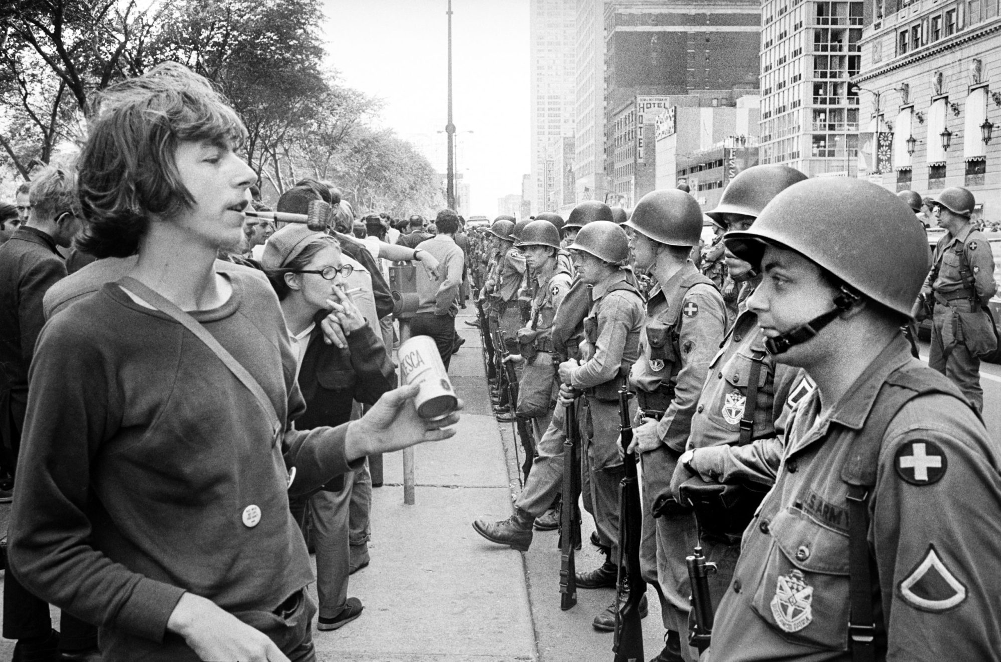 Group of People standing in front of row of National Guard soldiers, across from Hilton Hotel at Grant Park during Democratic National Convention, Chicago, Illinois. Photo by: Universal History Archive/Universal Images Group via Getty Images