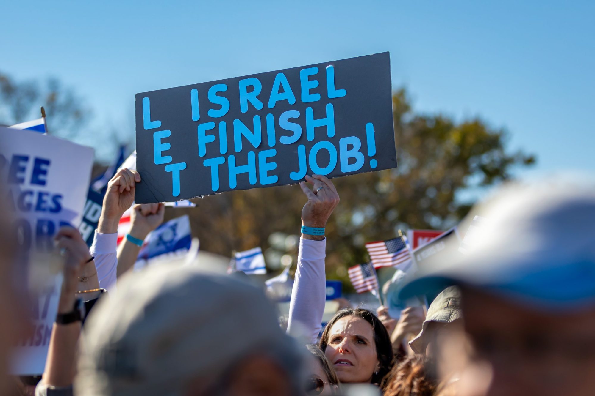 A pro-Israel supporter holds a sign during the "March for Israel" held on the National Mall. Over 60,000 people were expected to attend the rally in solidarity with Israel, calling for the release of the remaining hostages by Hamas. Photo by Michael Nigro/Pacific Press/LightRocket via Getty Images