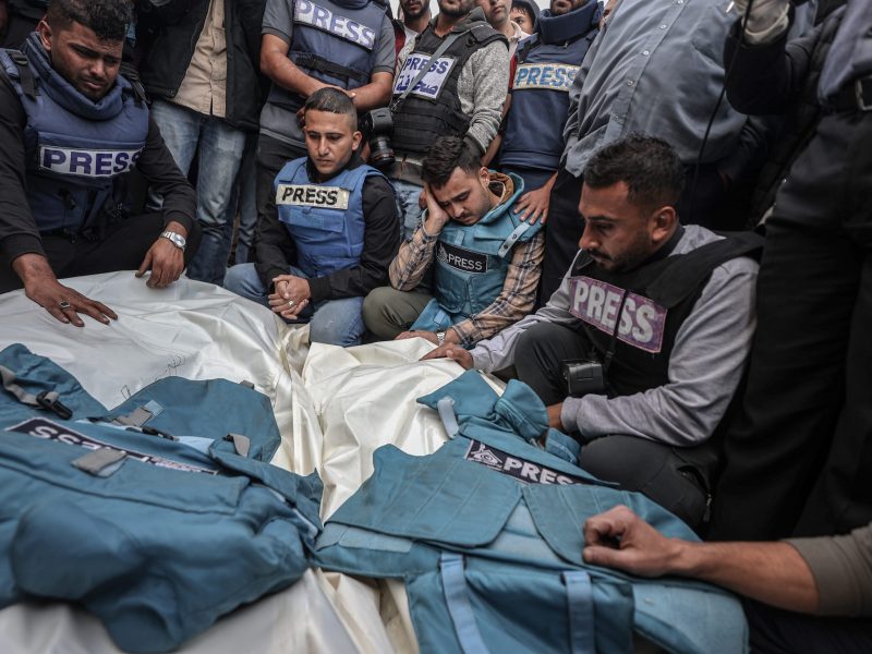 Relatives, colleagues and loved ones of Palestinian journalists Sari Mansour and Hasona Saliem, who were killed in the line of duty, mourn during funeral ceremony in Deir al-Balah, Gaza, on November 19, 2023. Photo by Ali Jadallah/Anadolu via Getty Images.