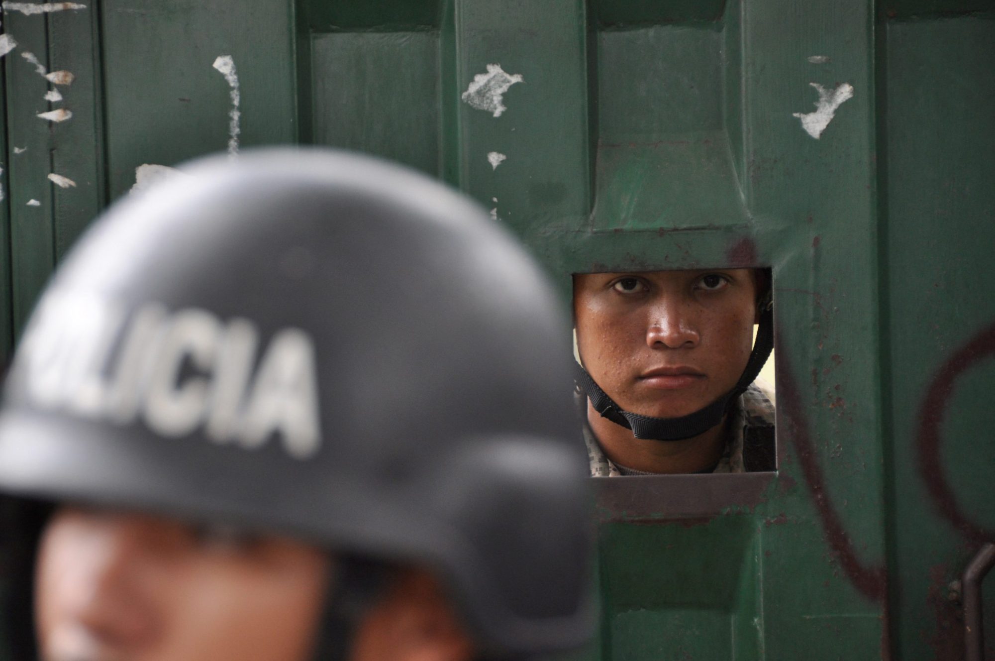 Police occupy the National Institute of Agrarian Reform in Tegucigalpa on September 30, 2009. Photo by YURI CORTEZ/AFP via Getty Images