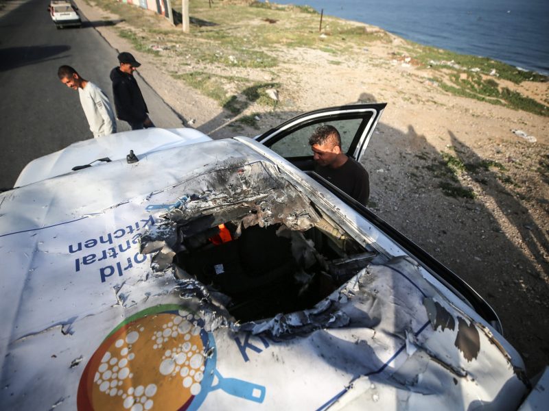 Palestinians are standing next to a vehicle in Deir Al-Balah, in the central Gaza Strip, on April 2, 2024, where employees from the World Central Kitchen, including foreigners, were killed in an Israeli airstrike, according to the NGO. Photo by Majdi Fathi/NurPhoto via Getty Images