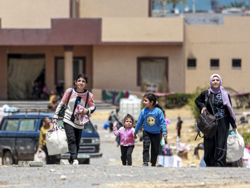 Displaced Palestinians who left with their belongings from Rafah in the southern Gaza Strip following an evacuation order by the Israeli army, arrive to Khan Yunis on May 6, 2024. Photo by -/AFP via Getty Images