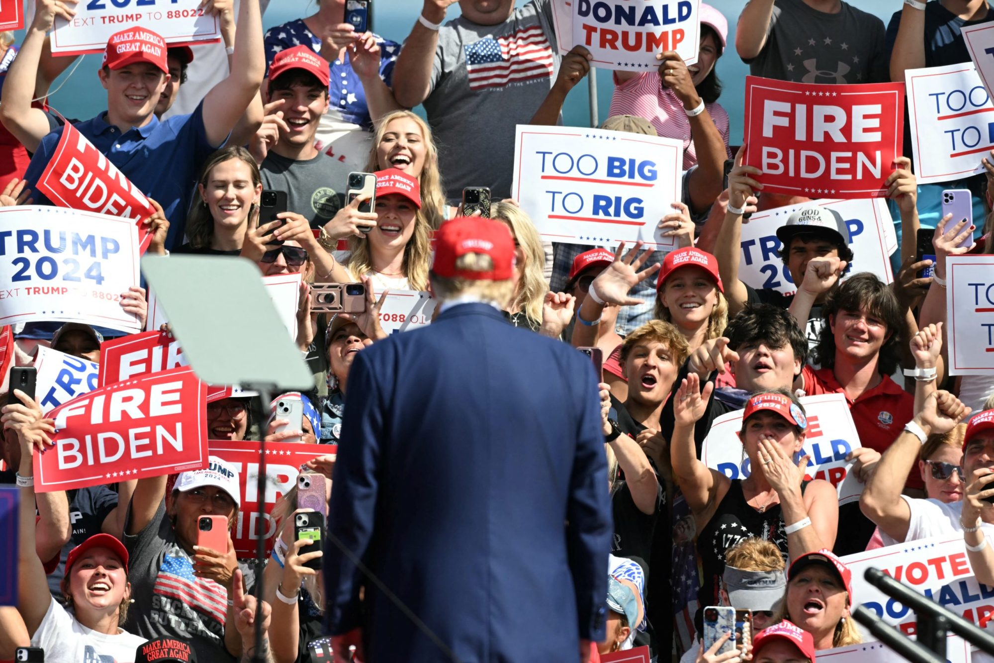 Supporters of former US President and Republican presidential candidate Donald Trump cheer as he arrives to speak at a campaign event in Racine, Wisconsin, on June 18, 2024. Photo by JIM WATSON/AFP via Getty Images