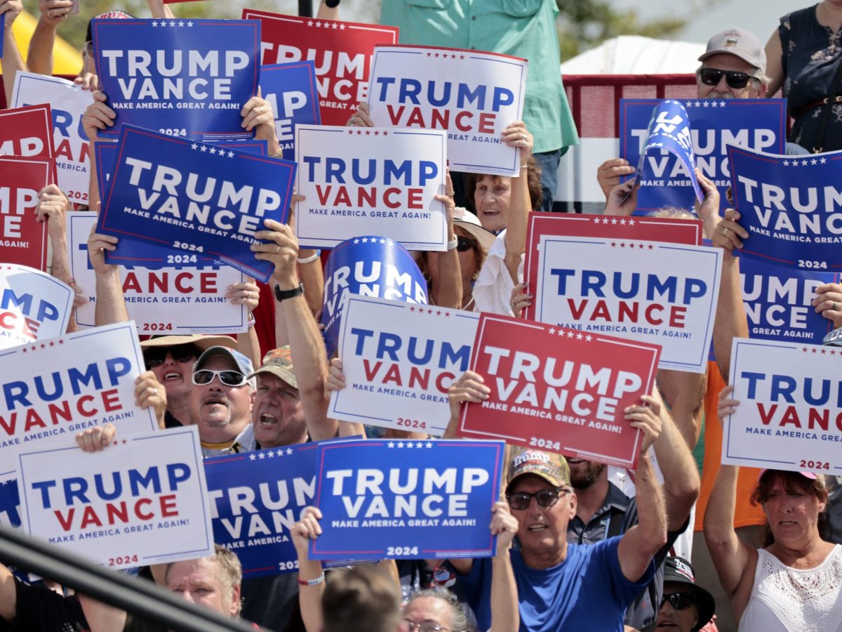 Supporters listen to US Senator and Republican vice presidential candidate J.D. Vance speak about the economy at Majestic Friesians Horse Farms in Big Rapids, Michigan, on August 27, 2024. Photo by JEFF KOWALSKY/AFP via Getty Images