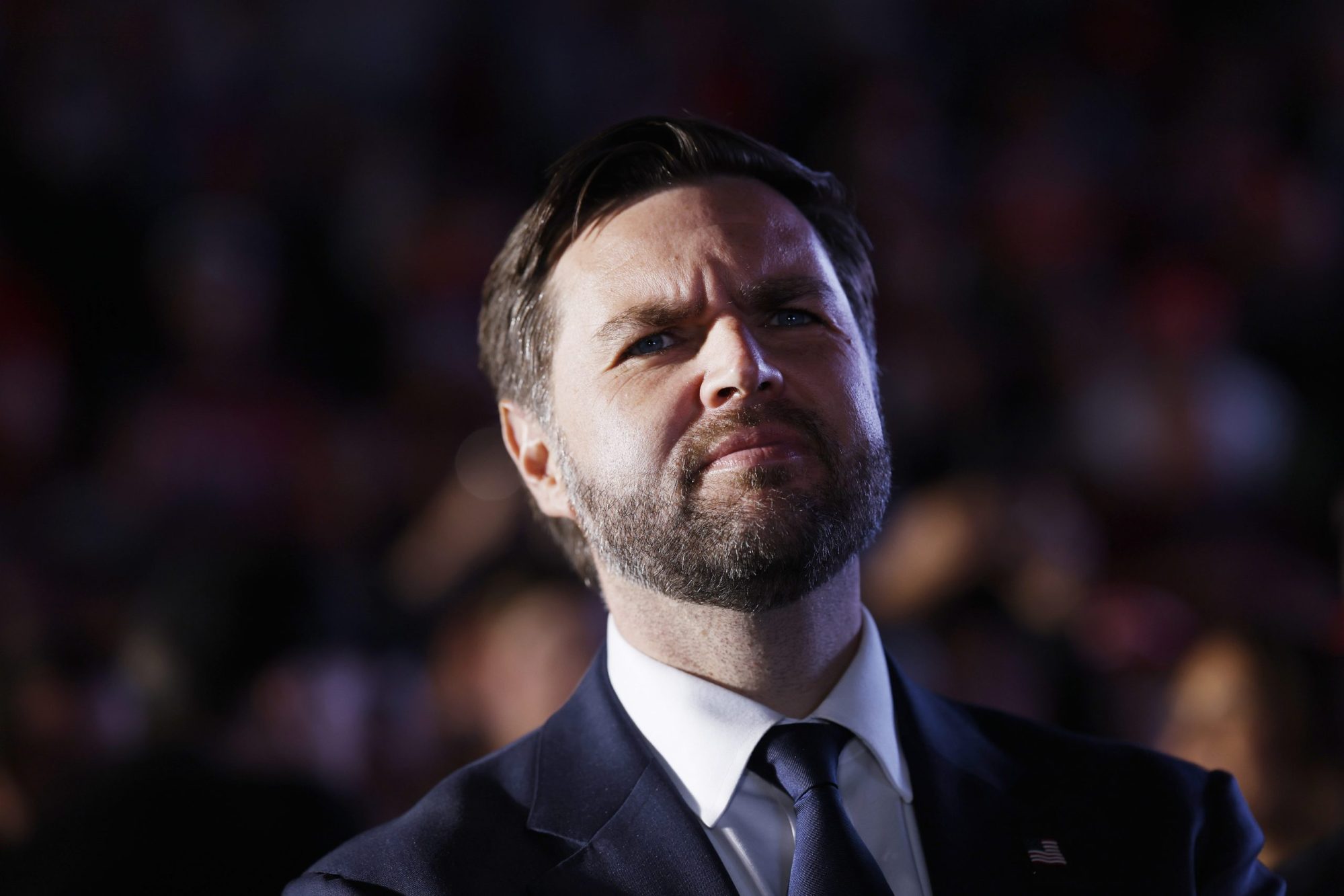 Republican vice presidential candidate Sen. JD Vance listens as Republican presidential nominee, former President Donald Trump speaks at a campaign rally at the Butler Farm Show fairgrounds on October 05, 2024 in Butler, Pennsylvania. Photo by Anna Moneymaker/Getty Images