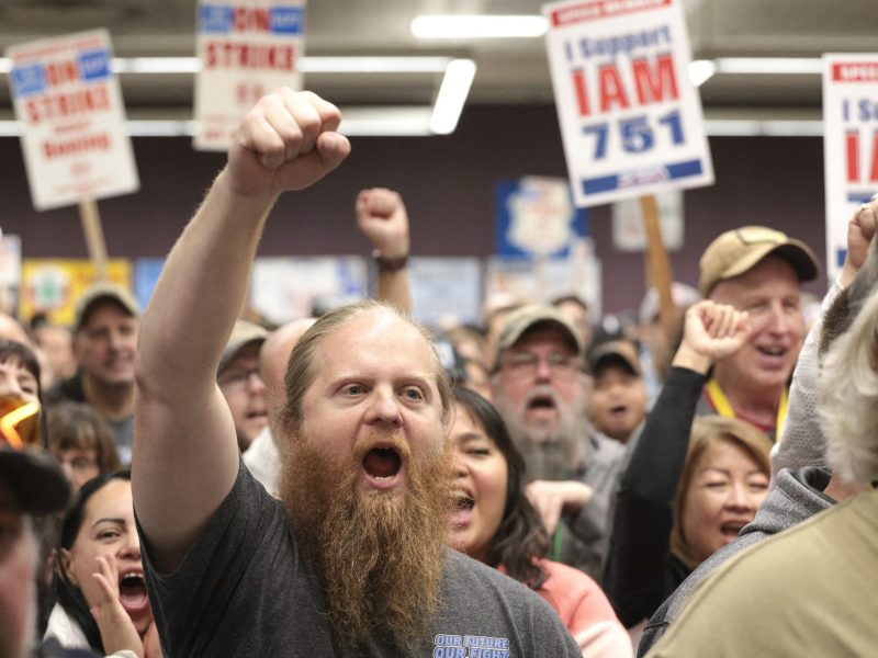 Ryan Bergh, a machinist at Boeing's factory in Everett, Washington for 10 years, cheers during a strike rally for the International Association of Machinists and Aerospace Workers (IAM) at the Seattle Union Hall in Seattle, Washington, on October 15, 2024. Photo by JASON REDMOND/AFP via Getty Images