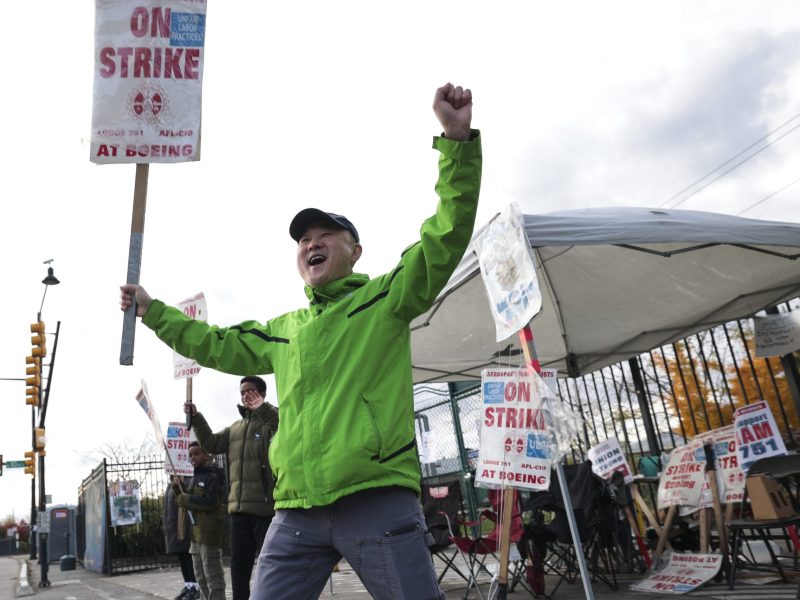 Boeing machinist Charlie Bae reacts to honking cars while picketing outside the Renton Production Facility one day before striking union members will vote on a new contract offer in Renton, Washington on November 3, 2024. Photo by JASON REDMOND/AFP via Getty Images