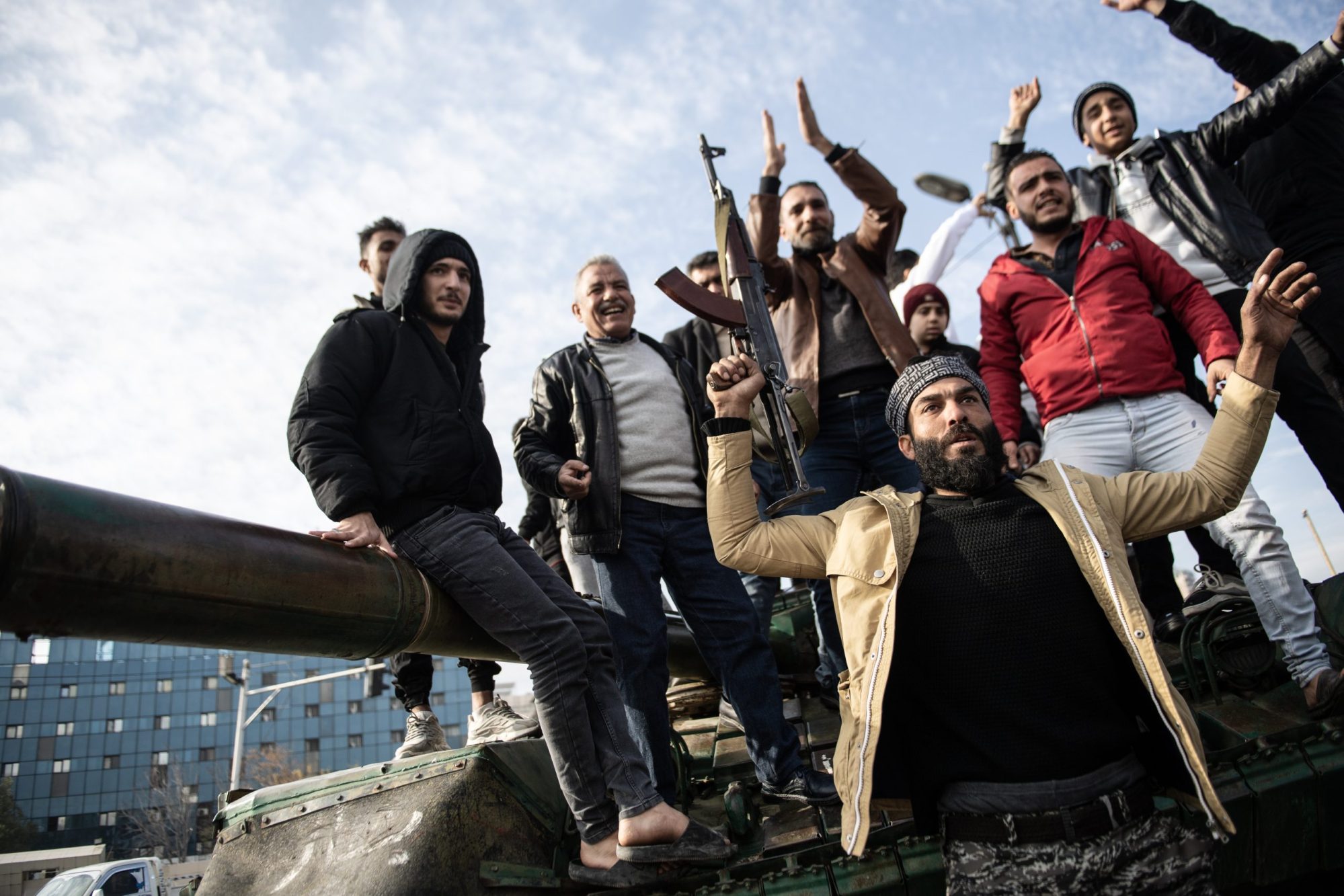 Syrians in the capital Damascus celebrate as sixty-one years of Baath Party rule in Syria collapses on Sunday when, the capital fell out of the hands of regime control on December 8, 2024. Photo by Ammar Ghali/Anadolu via Getty Images