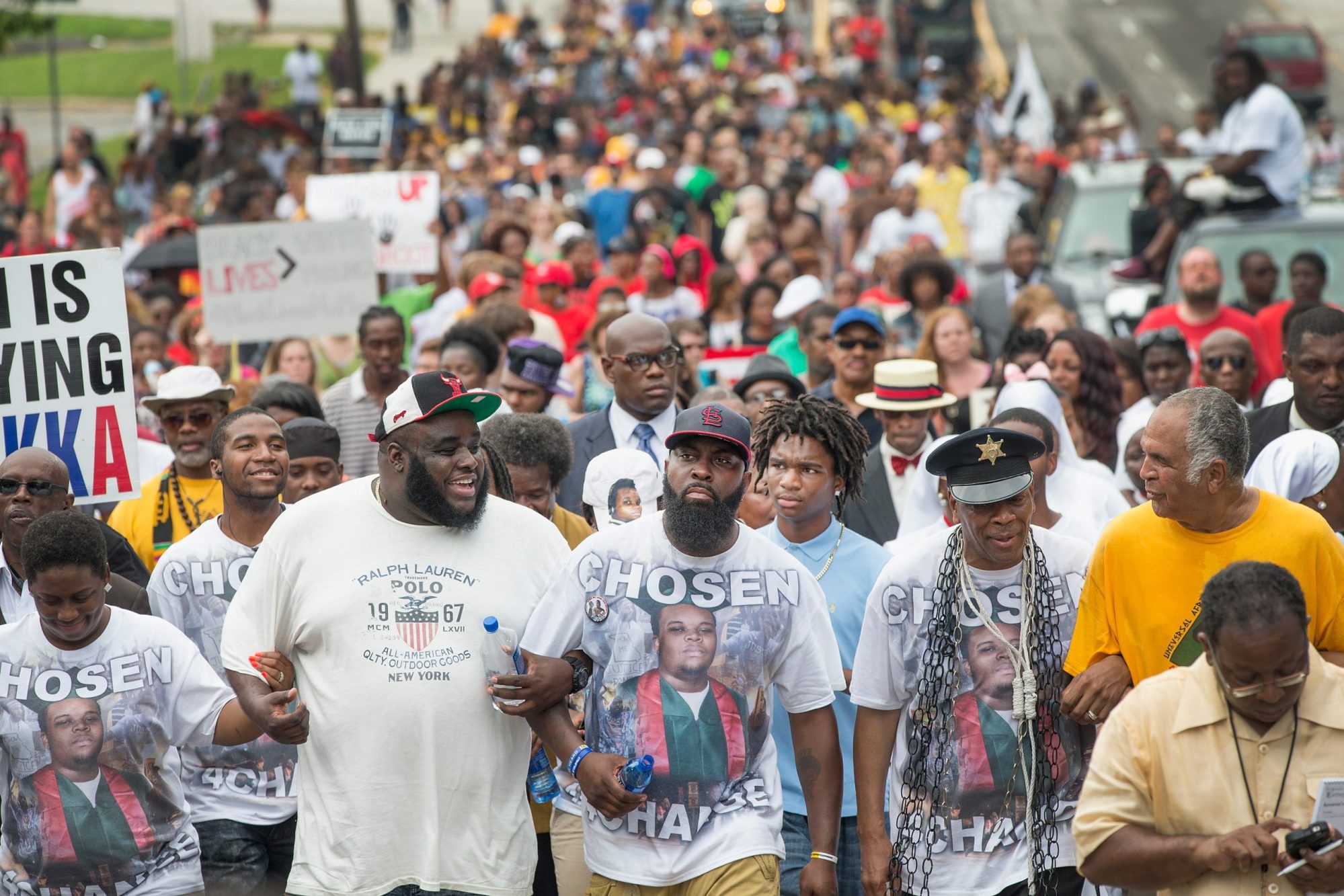 Michael Brown Sr. leads a march from the location where his son Michael Brown Jr. was shot and killed following a memorial service marking the anniversary of his death on August 9, 2015 in Ferguson, Missouri. Photo by Scott Olson/Getty Images