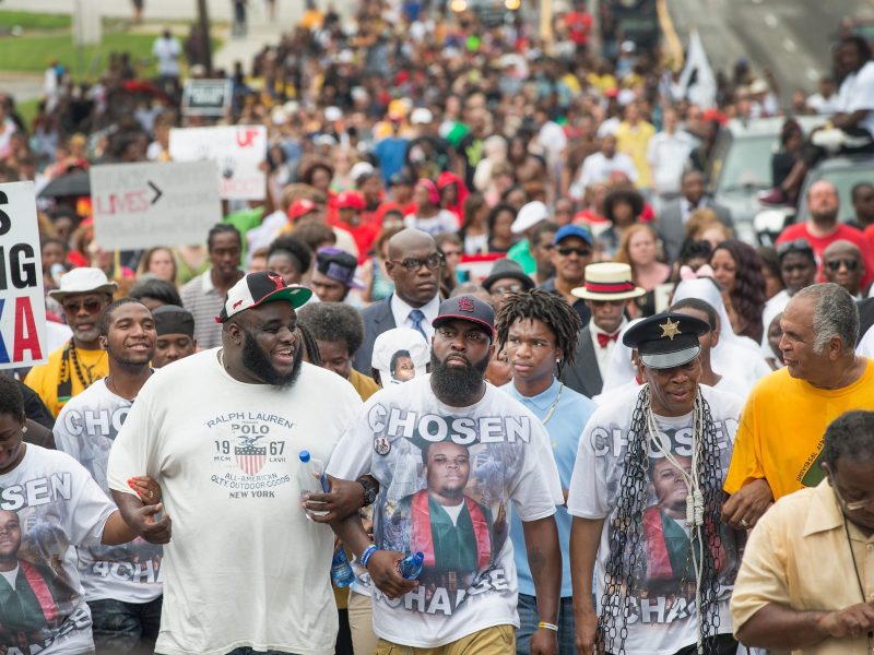 Michael Brown Sr. leads a march from the location where his son Michael Brown Jr. was shot and killed following a memorial service marking the anniversary of his death on August 9, 2015 in Ferguson, Missouri. Photo by Scott Olson/Getty Images