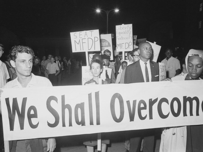 8/24/1964-Atlantic City, NJ: Some 100 civil rights demonstrators kept an all-night vigil before the Democratic Convention Hall in an attempt to seat members of the Freedom Democratic Party. In the center of the picture is Mrs. Rita Schwerner, widow of Michael Schwerner who was slain near Philadelphia, Mississippi this summer.