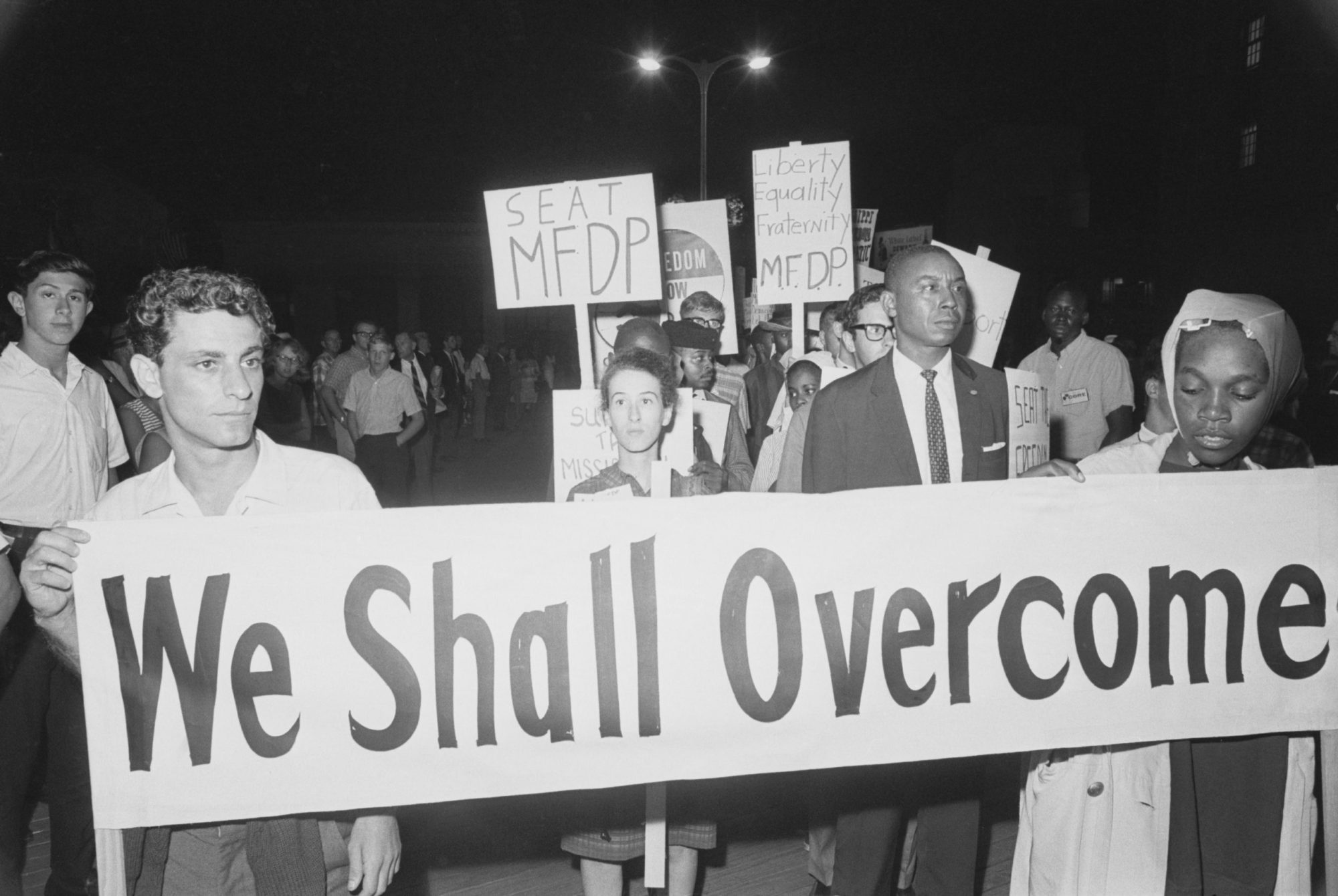 8/24/1964-Atlantic City, NJ: Some 100 civil rights demonstrators kept an all-night vigil before the Democratic Convention Hall in an attempt to seat members of the Freedom Democratic Party. In the center of the picture is Mrs. Rita Schwerner, widow of Michael Schwerner who was slain near Philadelphia, Mississippi this summer.