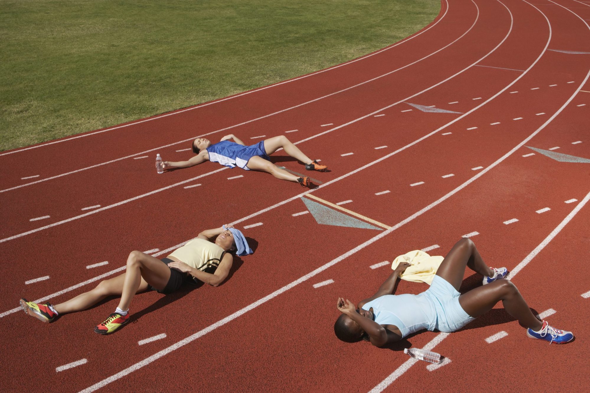 Exhausted runners on track. Photo via Getty Images