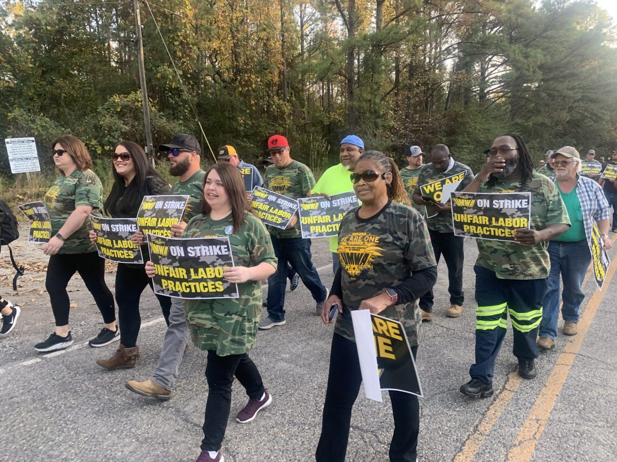 Striking Met Warrior Coal miners march along the road leading to the coal mine.